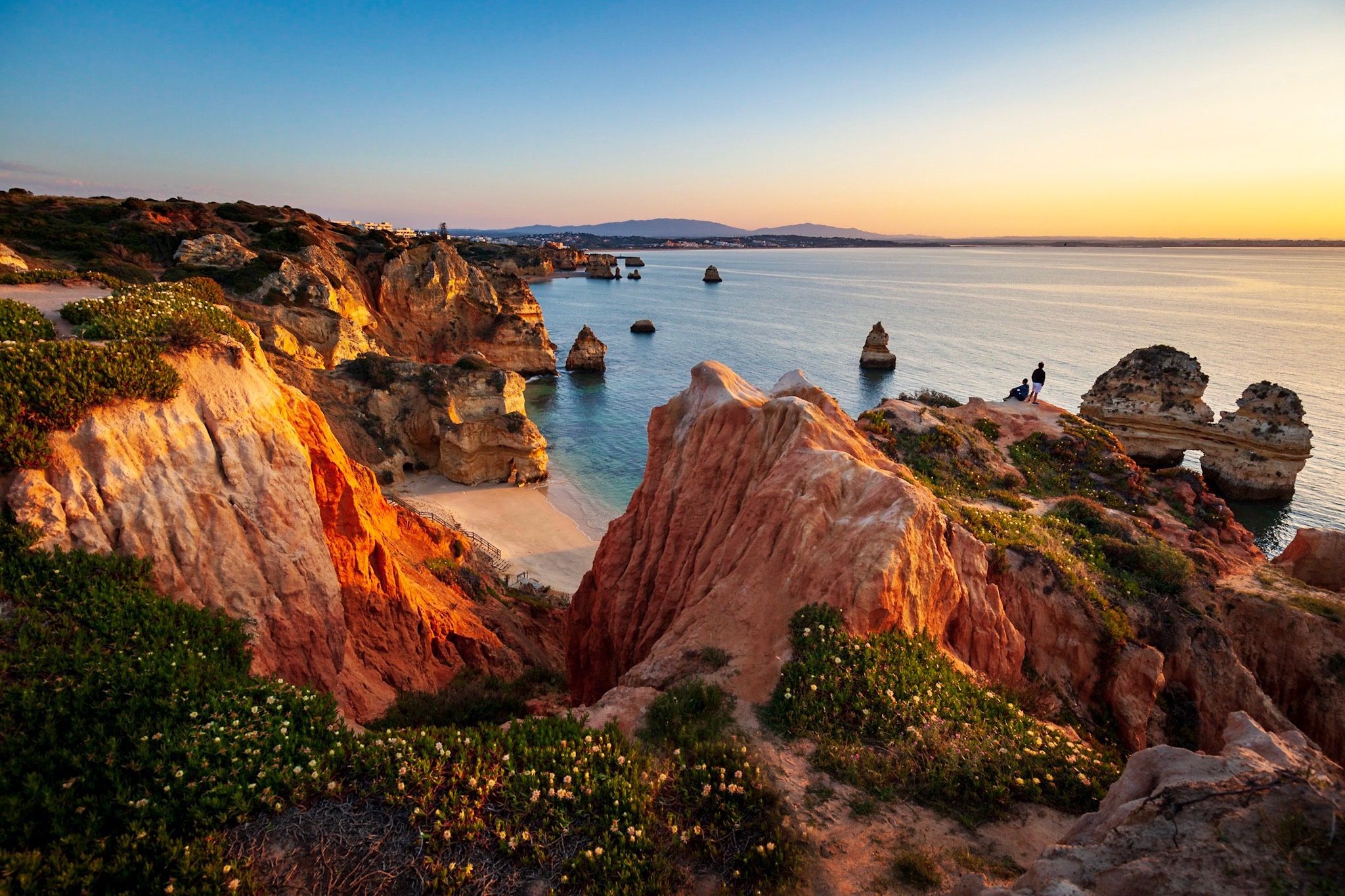 Algarve golden cliffs and turquoise coastline at sunset, incentive travel destination in southern Portugal