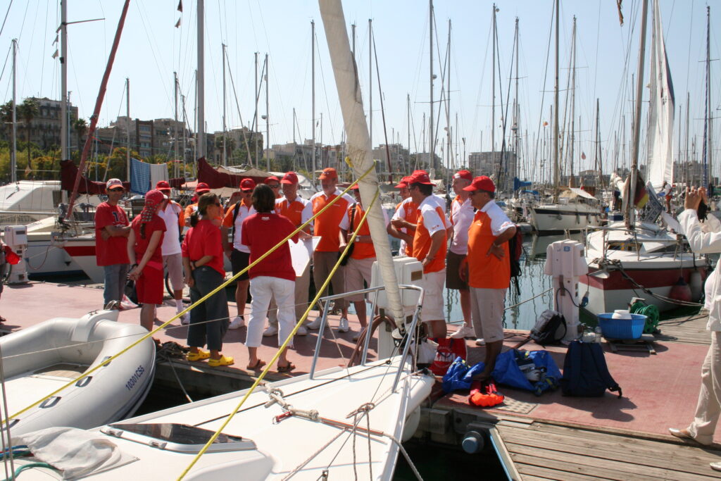 Corporate group receiving instructions before a team building sailing regatta
