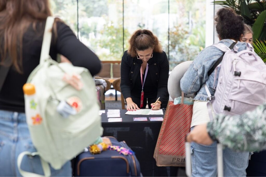 Crossover team helping at the hospitality desk where delegates were registering upon arrivel