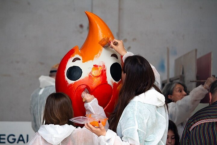 Participants crafting Fallas ninot figures in a hands-on workshop